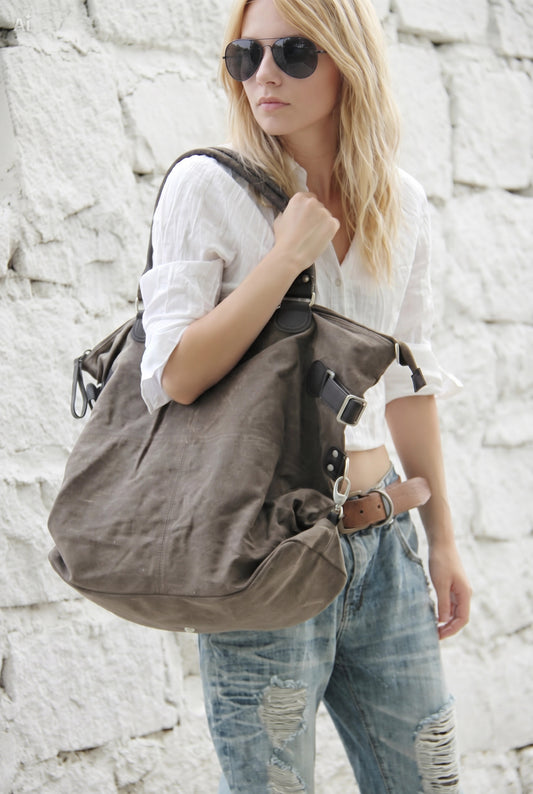 women’s canvas leather shopper bag worn on shoulder in city casual everyday style